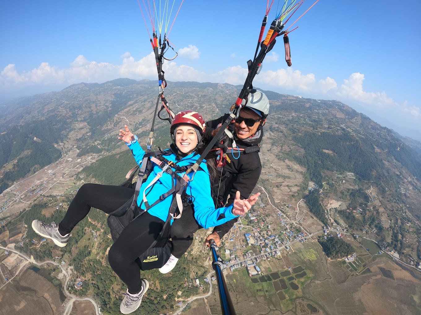 Tandem paragliding in Dharamshala with stunning views of the Dhauladhar mountains and valleys in Himachal Pradesh